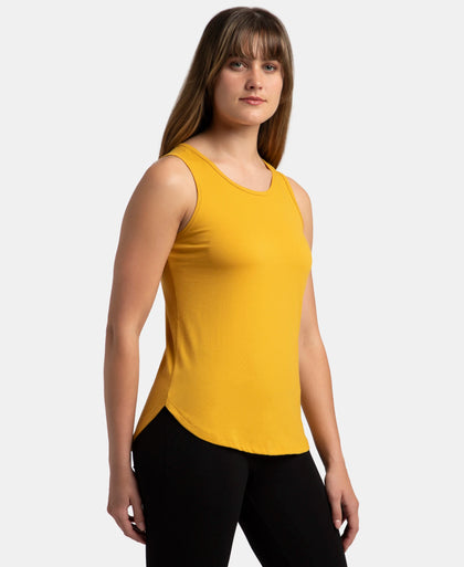 Super Combed Cotton Rich Solid Curved Hem Styled Tank Top - Golden Spice
